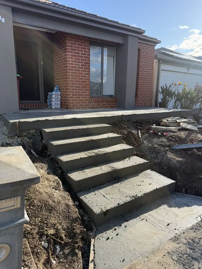 Concrete sub-grade with steps for paving